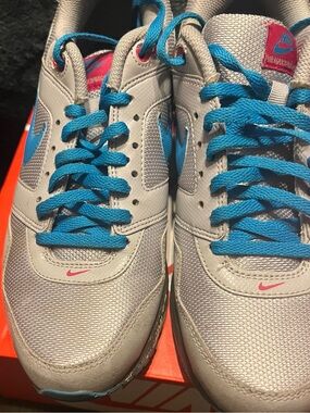 Nike White and Gray Kids Sneaker with Blue Accent